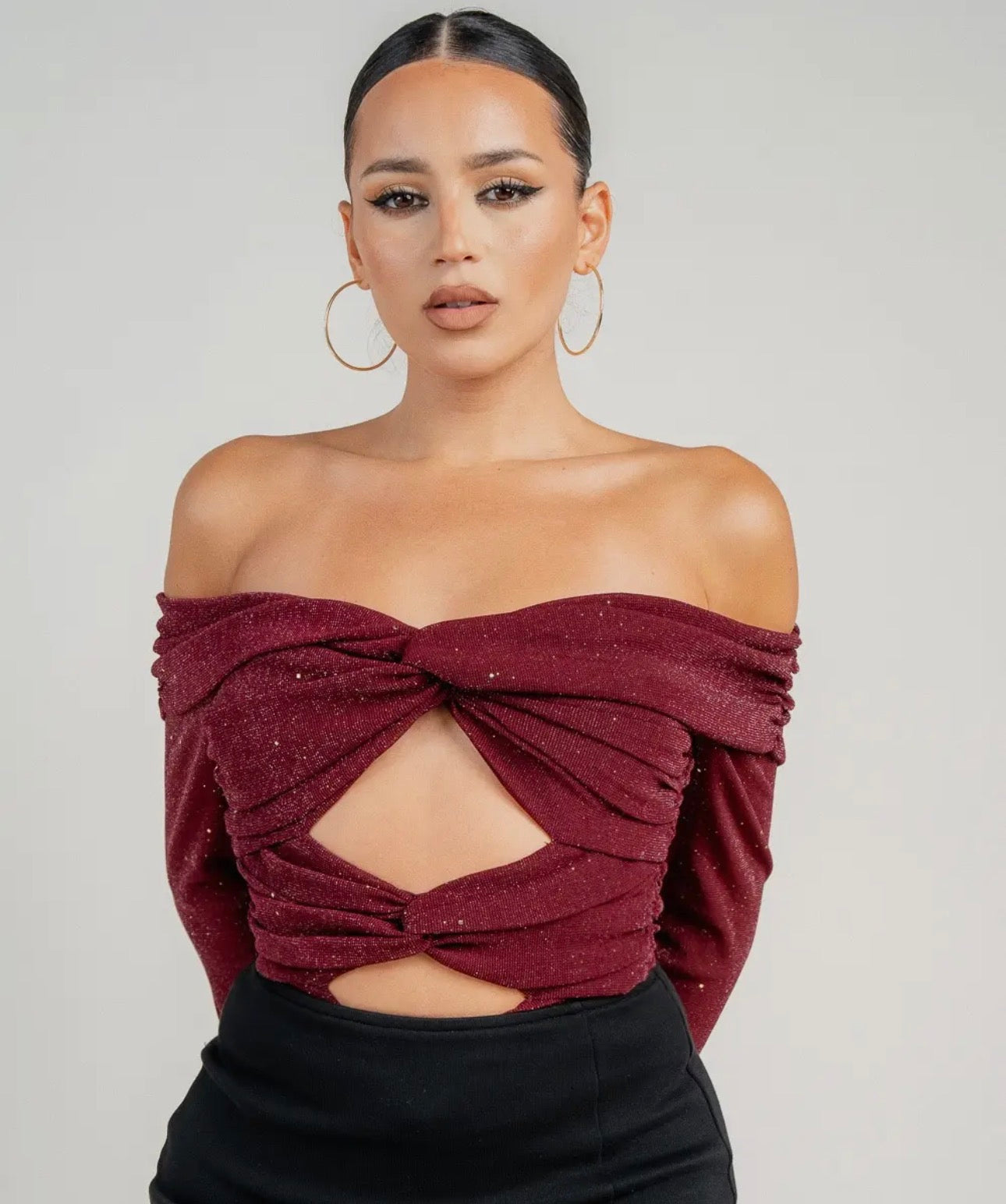 Body con detalles recortados y manga larga